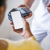 Woman making a payment with her smartphone