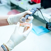 A denture being polished in a dental lab